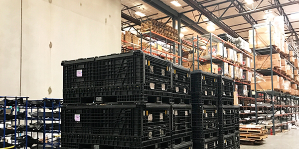Warehouse boxes and crates stacked high.