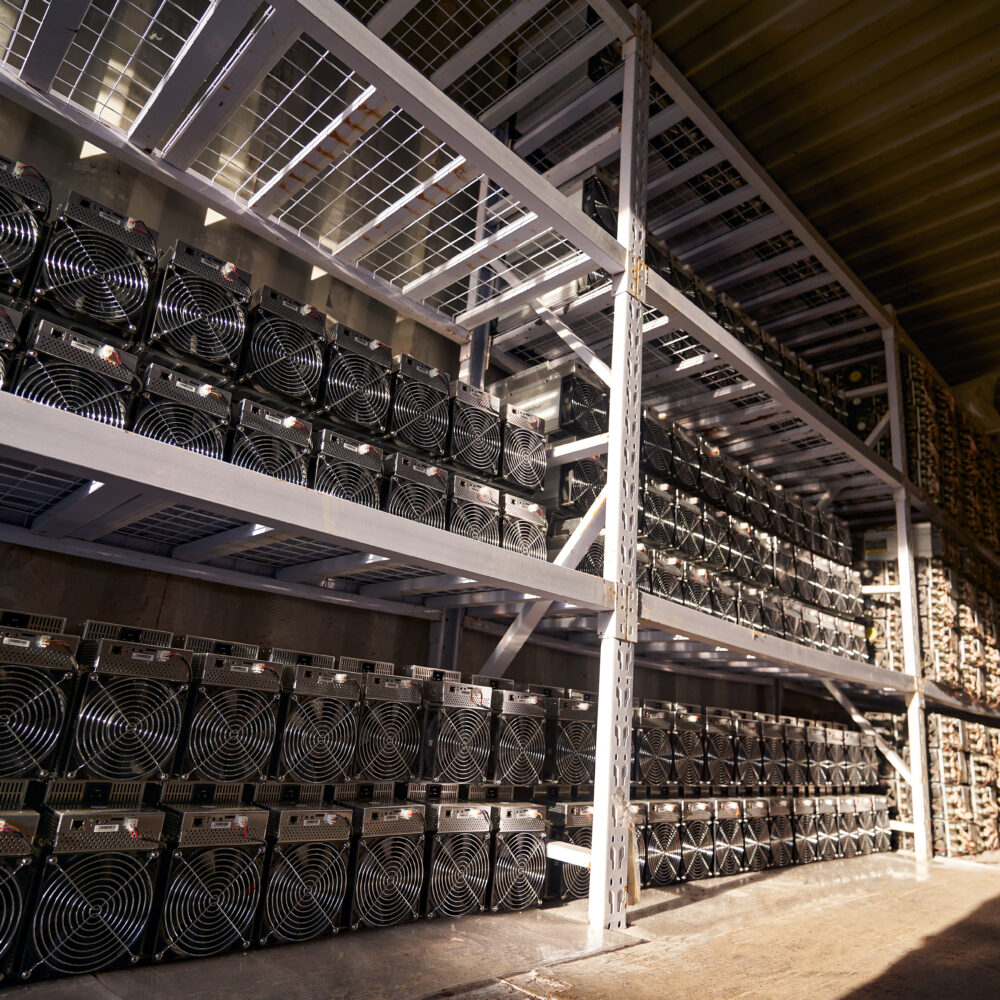 Crypto logistics concept showing data mining computer equipment in warehouse.