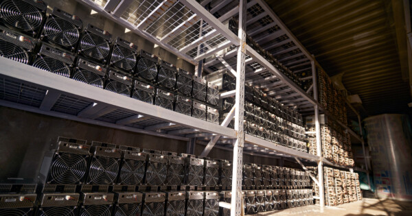 Crypto logistics concept showing data mining computer equipment in warehouse.