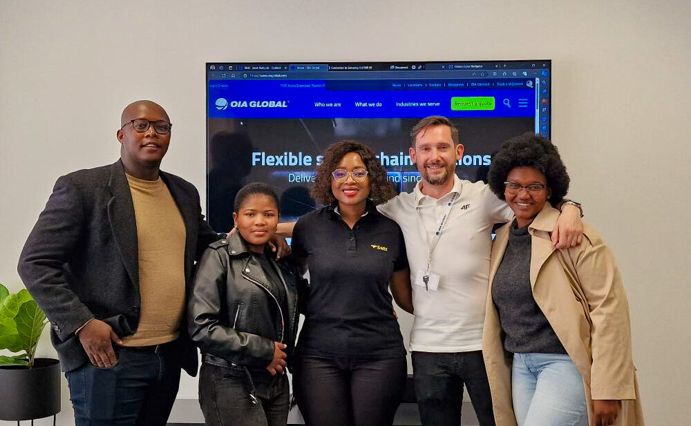 A group photo of the authorized economic operator AEO certified Johannesburg South Africa team in their meeting room.