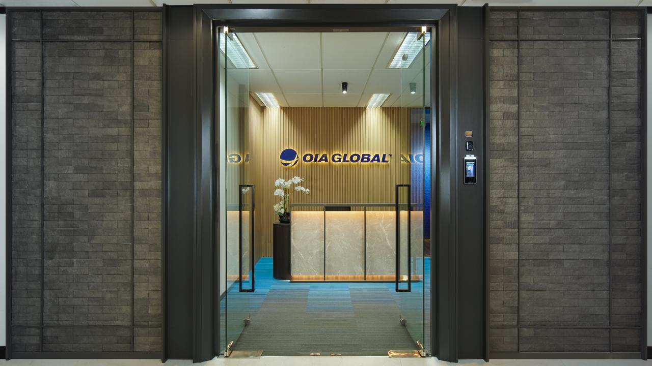 Jakarta freight forwarding office entrance with OIA Global logo.
