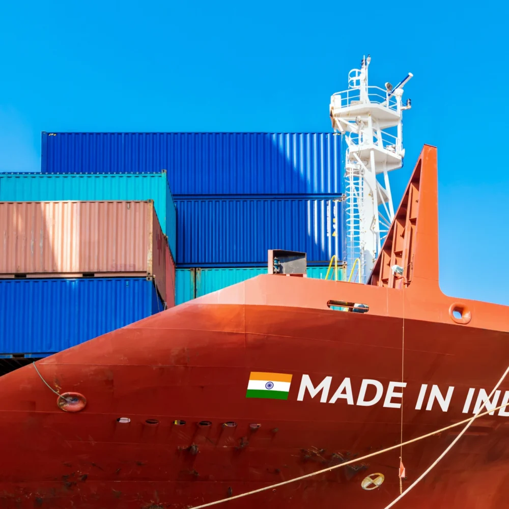 Cargo ship loaded with colorful shipping containers featuring ‘Made in India’ text