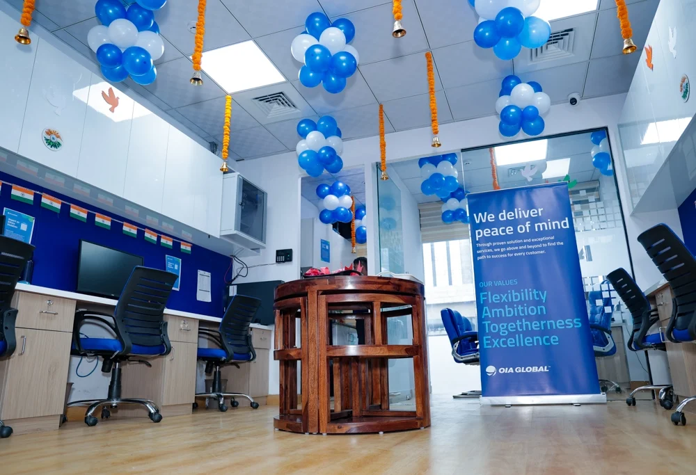 OIA Global New Delhi office interior decorated with balloons and company values banner