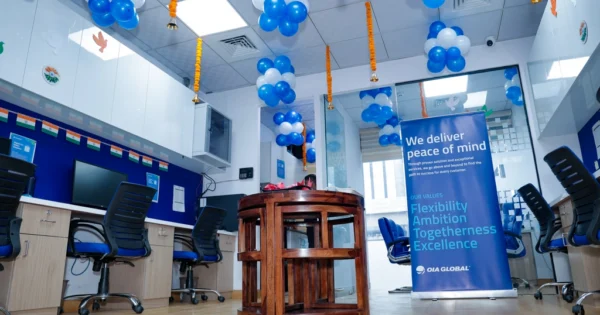 OIA Global New Delhi office interior decorated with balloons and company values banner