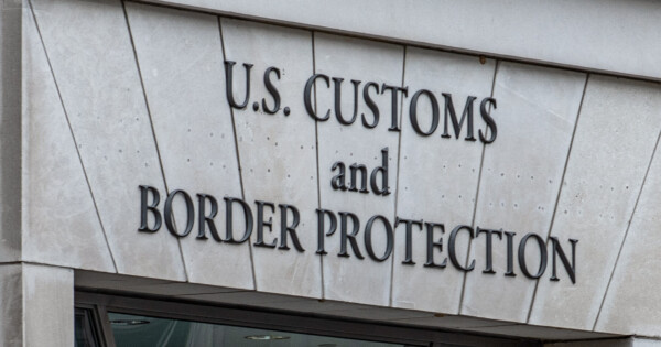 U.S. Customs and Border Protection sign on a government building exterior.